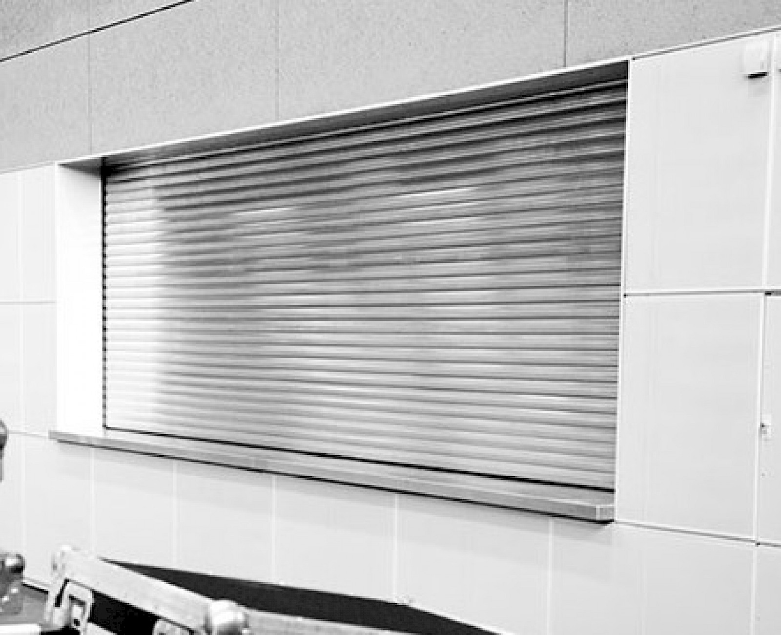 Counter closed by stainless steel security roller shutters